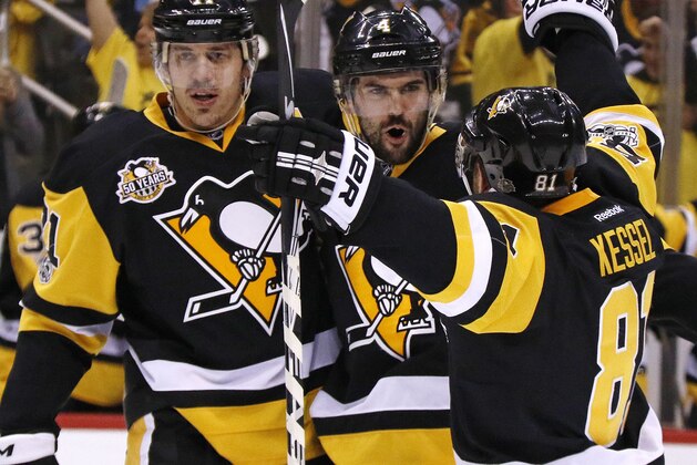 Pittsburgh Penguins' Justin Schultz (4) celebrates his goal with Evgeni Malkin (71) and Phil Kessel (81) during the second period of Game 4 in an NHL Stanley Cup Eastern Conference semifinal hockey game against the Washington Capitals in Pittsburgh, Wednesday, May 3, 2017. (AP Photo/Gene J. Puskar)