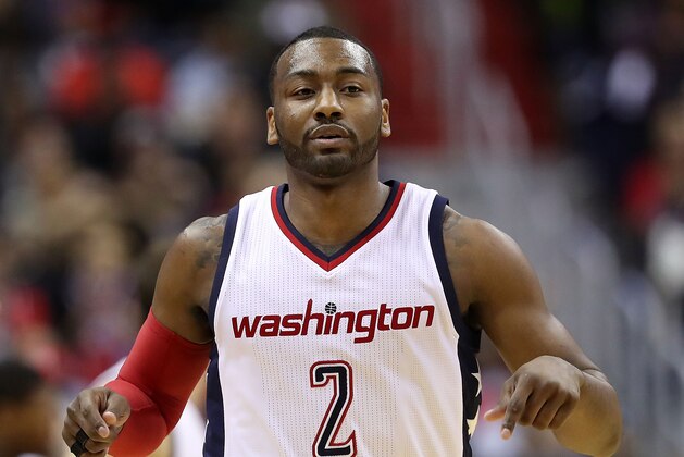 WASHINGTON, DC - MAY 12:  John Wall #2 of the Washington Wizards reacts after a basket against the Boston Celtics during Game Six of the NBA Eastern Conference Semi-Finals at Verizon Center on May 12, 2017 in Washington, DC.  NOTE TO USER: User expressly acknowledges and agrees that, by downloading and or using this photograph, User is consenting to the terms and conditions of the Getty Images License Agreement.  (Photo by Rob Carr/Getty Images)
