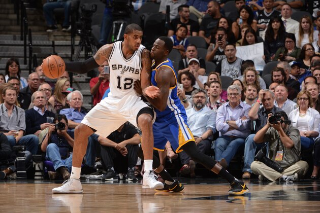 SAN ANTONIO, TX - MARCH 29: LaMarcus Aldridge #12 of the San Antonio Spurs handles the ball during the game against Draymond Green #23 of the Golden State Warriors on March 29, 2017 at AT&T Center in San Antonio, Texas. NOTE TO USER: User expressly acknowledges and agrees that, by downloading and or using this photograph, user is consenting to the terms and conditions of Getty Images License Agreement. Mandatory Copyright Notice: Copyright 2017 NBAE (Photo by Noah Graham/NBAE via Getty Images)