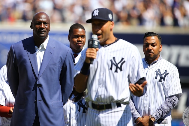 NEW YORK, NY - SEPTEMBER 07:  Derek Jeter #2 of the New York Yankees speaks to the crowd as basketball hall of famer Michael Jordan (L) looks on during Derek Jeter Day on September 7, 2014 before the game between the New York Yankees and the Kansas City Royals at Yankee Stadium in the Bronx borough of New York City.  (Photo by Al Bello/Getty Images)