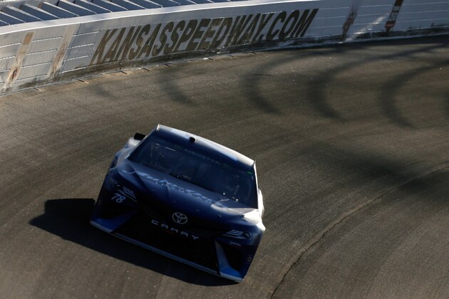 KANSAS CITY, KS - MAY 13:  Martin Truex Jr., driver of the #78 Auto-Owners Insurance Toyota, races during the Monster Energy NASCAR Cup Series Go Bowling 400 at Kansas Speedway on May 13, 2017 in Kansas City, Kansas.  (Photo by Sean Gardner/Getty Images)