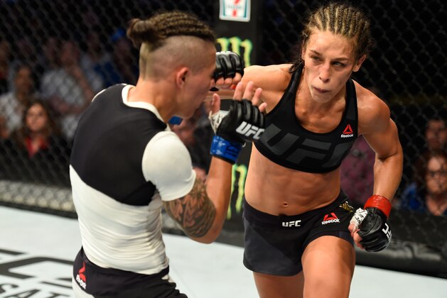 DALLAS, TX - MAY 13:  (R-L) Joanna Jedrzejczyk punches Jessica Andrade in their UFC women's strawweight championship fight during the UFC 211 event at the American Airlines Center on May 13, 2017 in Dallas, Texas. (Photo by Josh Hedges/Zuffa LLC/Zuffa LLC via Getty Images)