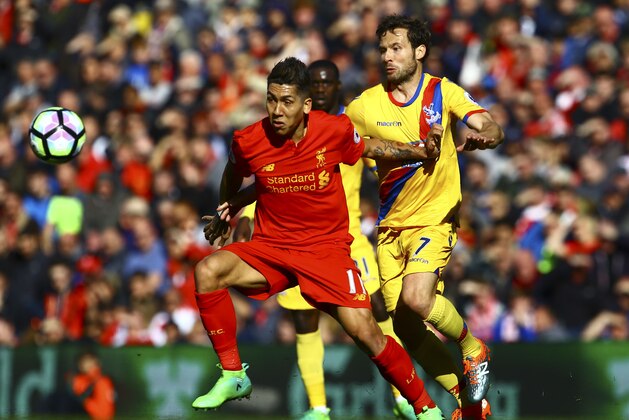 Liverpool's Brazilian midfielder Roberto Firmino (L) vies with Crystal Palace's French midfielder Yohan Cabaye during the English Premier League football match between Liverpool and Crystal Palace at Anfield in Liverpool, north west England on April 23, 2017. / AFP PHOTO / Geoff CADDICK / RESTRICTED TO EDITORIAL USE. No use with unauthorized audio, video, data, fixture lists, club/league logos or 'live' services. Online in-match use limited to 75 images, no video emulation. No use in betting, games or single club/league/player publications.  /         (Photo credit should read GEOFF CADDICK/AFP/Getty Images)