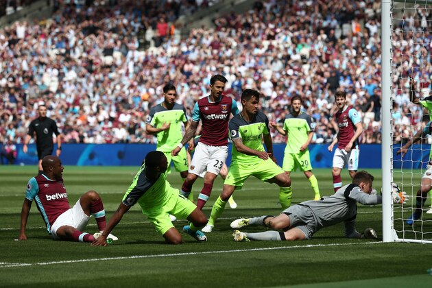 STRATFORD, ENGLAND - MAY 14: Simon Mignolet of Liverpool saves a shot from Andre Ayew of West Ham United during the Premier League match between West Ham United and Liverpool at London Stadium on May 14, 2017 in Stratford, England.  (Photo by Jan Kruger/Getty Images)
