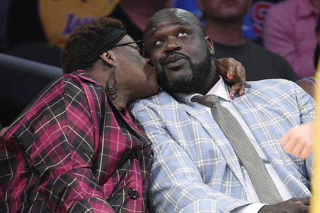 LOS ANGELES, CA - MARCH 24:  Former Los Angeles Lakers great Shaquille O'Neal (R) gets a kiss from his mother Lucille as they attend the Minnesota Timberwolves and Los Angeles Lakers game after his statue was unveiled earlier in the night at Staples Center March 24, 2017, in Los Angeles, California. NOTE TO USER: User expressly acknowledges and agrees that, by downloading and or using this photograph, User is consenting to the terms and conditions of the Getty Images License Agreement. (Photo by Kevork Djansezian/Getty Images)