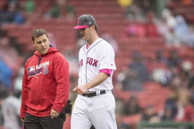 BOSTON, MA - MAY 14: Drew Pomeranz #31 of the Boston Red Sox exits the game with an injury alongside trainer Paul Buchheit during the fourth inning of a game against the Tampa Bay Rays on May 14, 2017 at Fenway Park in Boston, Massachusetts. Players are wearing pink to celebrate Mother's Day weekend and support breast cancer awareness. (Photo by Billie Weiss/Boston Red Sox/Getty Images)