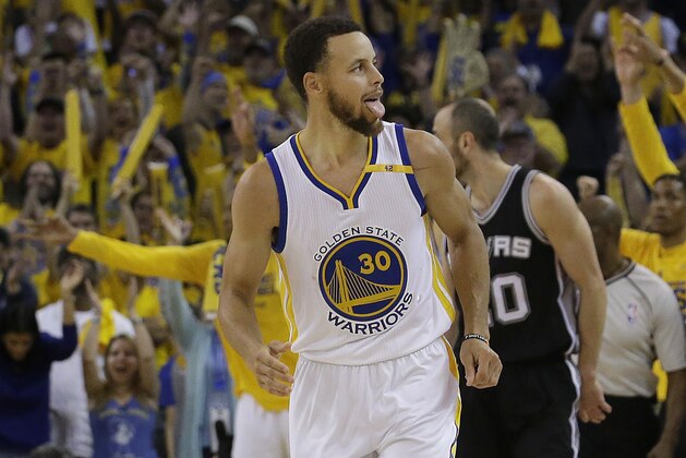 Golden State Warriors guard Stephen Curry (30) reacts after scoring against the San Antonio Spurs during the second half of Game 1 of the NBA basketball Western Conference finals in Oakland, Calif., Sunday, May 14, 2017. The Warriors won 113-111. (AP Photo/Jeff Chiu)