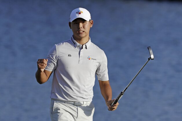 Si Woo Kim, of South Korea, celebrates after winning The Players Championship golf tournament Sunday, May 14, 2017, in Ponte Vedra Beach, Fla. (AP Photo/Chris O'Meara)