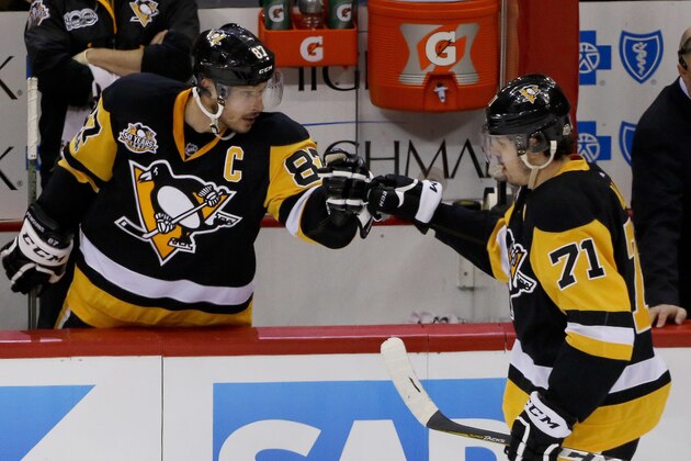 Pittsburgh Penguins' Sidney Crosby (87) greets center Evgeni Malkin (71) after Malkin scored a goal to tie the game against the Ottawa Senators during the third period of Game 1 of the Eastern Conference final in the NHL hockey Stanley Cup playoffs, Saturday, May 13, 2017, in Pittsburgh. (AP Photo/Gene J. Puskar)