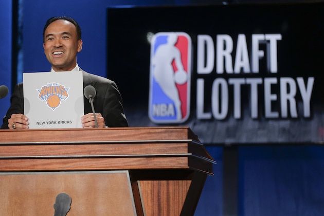 NBA Deputy Commissioner Mark Tatum announces that the New York Knicks have the fourth pick in the draft, during the NBA basketball draft lottery, Tuesday, May 19, 2015, in New York. (AP Photo/Julie Jacobson)