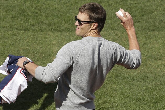 New England Patriots quarterback Tom Brady throws a ceremonial first pitch before a baseball game between the Boston Red Sox and the Pittsburgh Pirates on opening day at Fenway Park, Monday, April 3, 2017, in Boston. (AP Photo/Steven Senne)