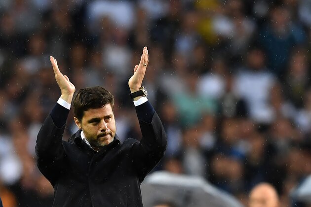Tottenham Hotspur's Argentinian head coach Mauricio Pochettino gestures in the rain during the closing ceremony at White Hart Lane in London, on May 14, 2017.
Tottenham Hotspur legends including Glenn Hoddle and Ossie Ardiles took part in an on-pitch ceremony as the club said goodbye to their White Hart Lane stadium on Sunday. / AFP PHOTO / Ben STANSALL / RESTRICTED TO EDITORIAL USE. No use with unauthorized audio, video, data, fixture lists, club/league logos or 'live' services. Online in-match use limited to 45 images, no video emulation. No use in betting, games or single club/league/player publications.        (Photo credit should read BEN STANSALL/AFP/Getty Images)