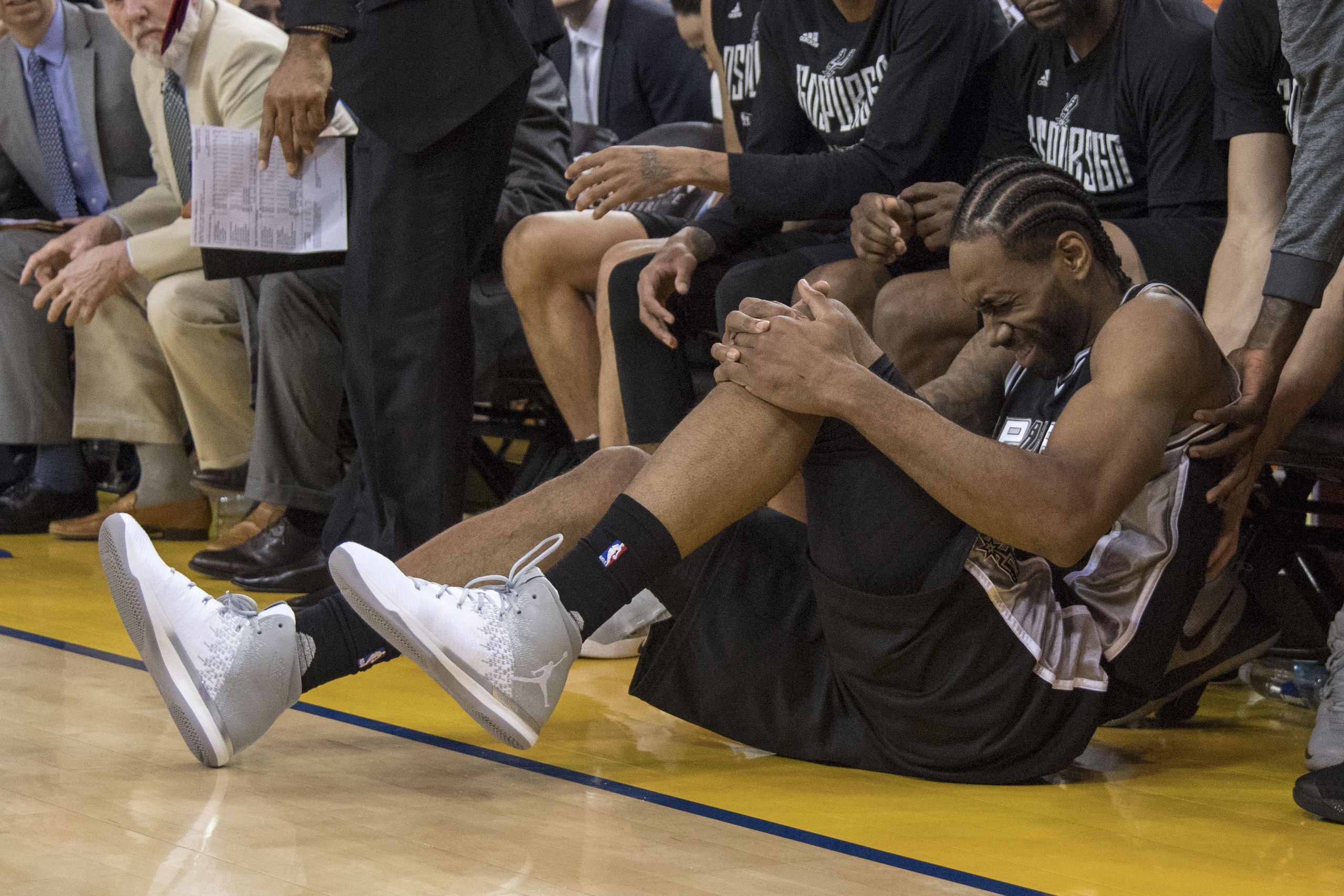 May 14, 2017; Oakland, CA, USA; San Antonio Spurs forward Kawhi Leonard (2) reacts after an injury during the third quarter in game one of the Western conference finals of the 2017 NBA Playoffs against the Golden State Warriors at Oracle Arena. The Warriors defeated the Spurs 113-111. Mandatory Credit: Kyle Terada-USA TODAY Sports May 14, 2017; Oakland, CA, USA; San Antonio Spurs forward Kawhi Leonard (2) reacts after an injury during the third quarter in game one of the Western conference finals of the 2017 NBA Playoffs against the Golden State Warriors at Oracle Arena. The Warriors defeated the Spurs 113-111. Mandatory Credit: Kyle Terada-USA TODAY Sports