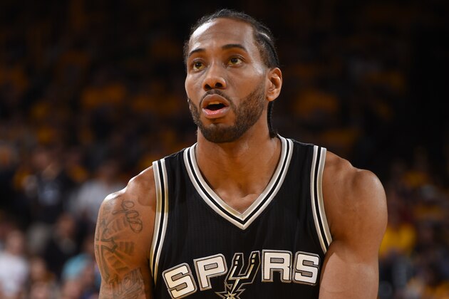 OAKLAND, CA - MAY 14: Kawhi Leonard #2 of the San Antonio Spurs shoots the ball against the Golden State Warriors in Game One of the Western Conference Finals of the 2017 NBA Playoffs on May 14, 2017 at ORACLE Arena in Oakland, California. NOTE TO USER: User expressly acknowledges and agrees that, by downloading and/or using this Photograph, user is consenting to the terms and conditions of the Getty Images License Agreement. Mandatory Copyright Notice: Copyright 2017 NBAE (Photo by Andrew D. Bernstein/NBAE via Getty Images)