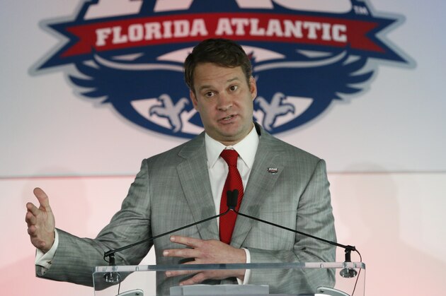 Lane Kiffin gestures as he speaks after being introduced as the new Florida Atlantic head football coach, Tuesday, Dec. 13, 2016, in Boca Raton, Fla. The school announced the move on Twitter on Tuesday, a day after Alabama coach Nick Saban said his offensive coordinator was leaving to take over the Owls. It's the fourth opportunity for Kiffin to be a head coach, after an NFL stint with the Oakland Raiders and college ones at Tennessee and USC. (AP Photo/Wilfredo Lee)