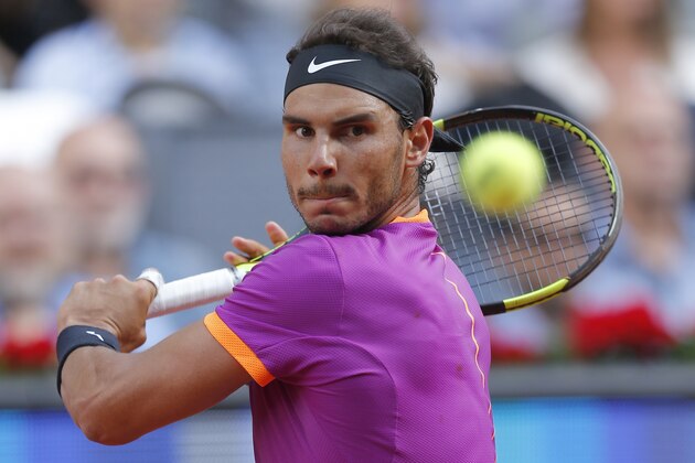 Spain's Rafael Nadal plays a shot in the final of the Madrid Open tennis tournament against Austria's Dominic Thiem in Madrid, Spain, Sunday, May 14, 2017. (AP Photo/Daniel Ochoa de Olza) Spain's Rafael Nadal plays a shot in the final of the Madrid Open tennis tournament against Austria's Dominic Thiem in Madrid, Spain, Sunday, May 14, 2017. (AP Photo/Daniel Ochoa de Olza)