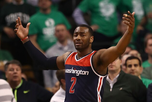 BOSTON, MA - MAY 15:  John Wall #2 of the Washington Wizards reacts against the Boston Celtics during Game Seven of the NBA Eastern Conference Semi-Finals at TD Garden on May 15, 2017 in Boston, Massachusetts.  NOTE TO USER: User expressly acknowledges and agrees that, by downloading and or using this photograph, User is consenting to the terms and conditions of the Getty Images License Agreement.  (Photo by Elsa/Getty Images)