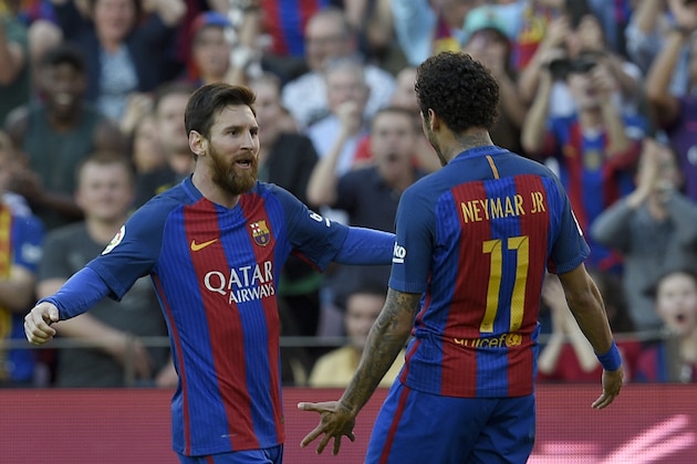 Barcelona's Argentinian forward Lionel Messi (L) celebrates with Barcelona's Brazilian forward Neymar after scoring a goal during the Spanish league football match FC Barcelona vs Villarreal CF at the Camp Nou stadium in Barcelona on May 6, 2017. / AFP PHOTO / LLUIS GENE        (Photo credit should read LLUIS GENE/AFP/Getty Images)