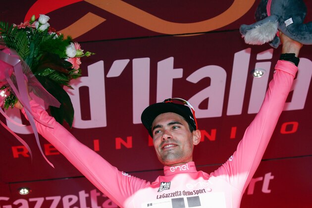 Dutch cyclist Tom Dumoulin from Team Sunweb celebrates his pink jersey of the overall leader on the podium after winning the 10th stage from Foligno to Montefalco during the 100th Giro d'Italia, Tour of Italy on May 16, 2017 in Montefalco. / AFP PHOTO / LUK BENIES        (Photo credit should read LUK BENIES/AFP/Getty Images)
