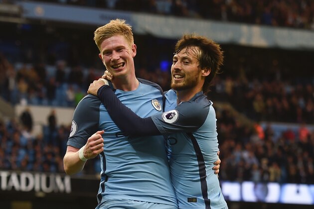 Manchester City's Belgian midfielder Kevin De Bruyne (L) celebrates scoring their second goal with Manchester City's Spanish midfielder David Silva (R) during the English Premier League football match between Manchester City and West Bromwich Albion at the Etihad Stadium in Manchester, north west England, on May 16, 2017. / AFP PHOTO / PAUL ELLIS / RESTRICTED TO EDITORIAL USE. No use with unauthorized audio, video, data, fixture lists, club/league logos or 'live' services. Online in-match use limited to 75 images, no video emulation. No use in betting, games or single club/league/player publications. / (Photo credit should read PAUL ELLIS/AFP/Getty Images) Manchester City's Belgian midfielder Kevin De Bruyne (L) celebrates scoring their second goal with Manchester City's Spanish midfielder David Silva (R) during the English Premier League football match between Manchester City and West Bromwich Albion at the Etihad Stadium in Manchester, north west England, on May 16, 2017. / AFP PHOTO / PAUL ELLIS / RESTRICTED TO EDITORIAL USE. No use with unauthorized audio, video, data, fixture lists, club/league logos or 'live' services. Online in-match use limited to 75 images, no video emulation. No use in betting, games or single club/league/player publications. / (Photo credit should read PAUL ELLIS/AFP/Getty Images)