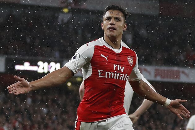 Arsenal's Chilean striker Alexis Sanchez celebrates scoring the second goal during the English Premier League football match between Arsenal and Sunderland at the Emirates Stadium in London on May 16, 2017.  / AFP PHOTO / Adrian DENNIS / RESTRICTED TO EDITORIAL USE. No use with unauthorized audio, video, data, fixture lists, club/league logos or 'live' services. Online in-match use limited to 75 images, no video emulation. No use in betting, games or single club/league/player publications.  /         (Photo credit should read ADRIAN DENNIS/AFP/Getty Images)