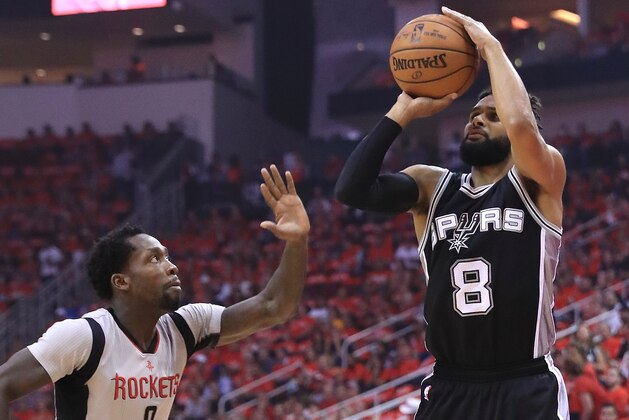 HOUSTON, TX - MAY 11:  Patty Mills #8 of the San Antonio Spurs shoots against Patrick Beverley #2 of the Houston Rockets during Game Six of the NBA Western Conference Semi-Finals at Toyota Center on May 11, 2017 in Houston, Texas.  NOTE TO USER: User expressly acknowledges and agrees that, by downloading and or using this photograph, User is consenting to the terms and conditions of the Getty Images License Agreement.  (Photo by Ronald Martinez/Getty Images)