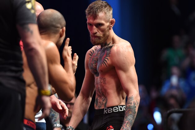 LAS VEGAS, NEVADA - DECEMBER 11:  UFC featherweight champion Jose Aldo of Brazil (L) faces off against Conor McGregor of Ireland (R) during the UFC 194 Weigh-in event at the MGM Grand Garden Arena on December 11, 2015 in Las Vegas, Nevada.  (Photo by Jeff Bottari/Zuffa LLC/Zuffa LLC via Getty Images)
