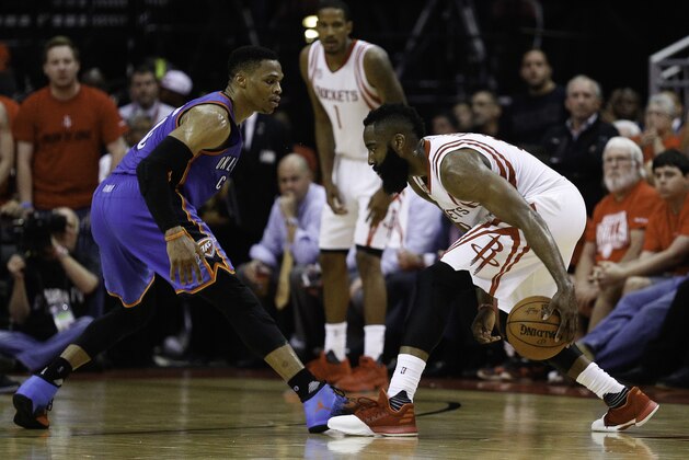 HOUSTON, TX - APRIL 25:  James Harden #13 of the Houston Rockets looks to drive on Russell Westbrook #0 of the Oklahoma City Thunder during Game Five of the Western Conference Quarterfinals game of the 2017 NBA Playoffs at Toyota Center on April 25, 2017 in Houston, Texas. NOTE TO USER: User expressly acknowledges and agrees that, by downloading and/or using this photograph, user is consenting to the terms and conditions of the Getty Images License Agreement.  (Photo by Bob Levey/Getty Images)
