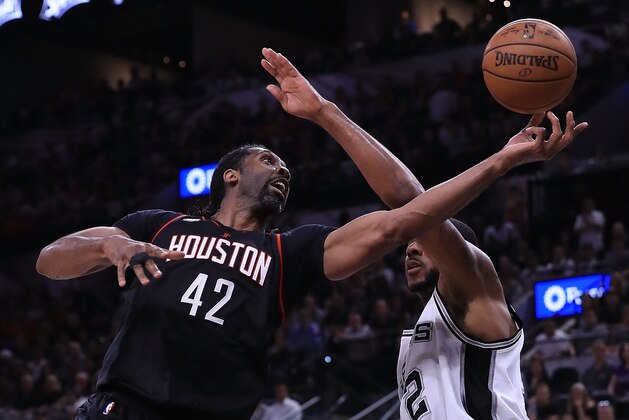 SAN ANTONIO, TX - MAY 03:  Nene Hilario #42 of the Houston Rockets drives against LaMarcus Aldridge #12 of the San Antonio Spurs during Game Two of the NBA Western Conference Semi-Finals at AT&T Center on May 3, 2017 in San Antonio, Texas.  NOTE TO USER: User expressly acknowledges and agrees that, by downloading and or using this photograph, User is consenting to the terms and conditions of the Getty Images License Agreement.  (Photo by Ronald Martinez/Getty Images)