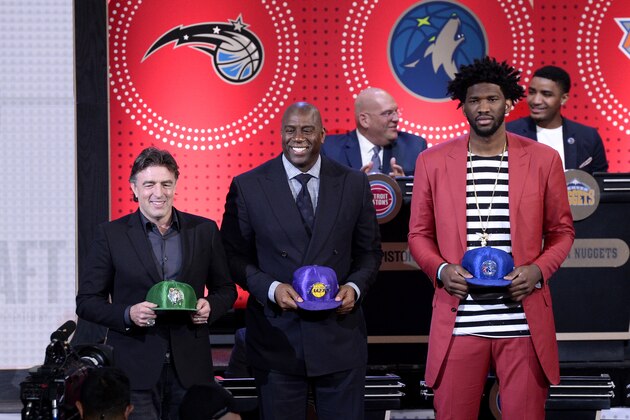 NEW YORK, NEW YORK - MAY 16:  Joel Embiid #21 of the Philadelphia 76ers, Magic Johnson of the Los Angeles Lakers, and Wycliffe Grousbeck of the Boston Celtics look on during the 2017 NBA Draft Lottery at the New York Hilton in New York, New York. NOTE TO USER: User expressly acknowledges and agrees that, by downloading and or using this Photograph, user is consenting to the terms and conditions of the Getty Images License Agreement.  Mandatory Copyright Notice: Copyright 2017 NBAE (Photo by David Dow/NBAE via Getty Images)