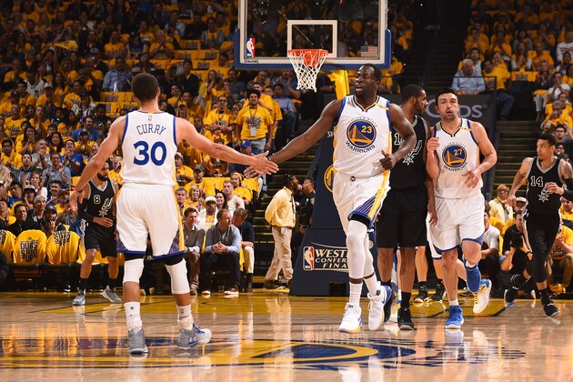 OAKLAND, CA - MAY 16: Stephen Curry #30 and Draymond Green #23 of the Golden State Warriors high five each other during the game against the San Antonio Spurs during Game Two of the Western Conference Finals of the 2017 NBA Playoffs on May 16, 2017 at ORACLE Arena in Oakland, California. NOTE TO USER: User expressly acknowledges and agrees that, by downloading and or using this photograph, user is consenting to the terms and conditions of Getty Images License Agreement. Mandatory Copyright Notice: Copyright 2017 NBAE (Photo by Noah Graham/NBAE via Getty Images)