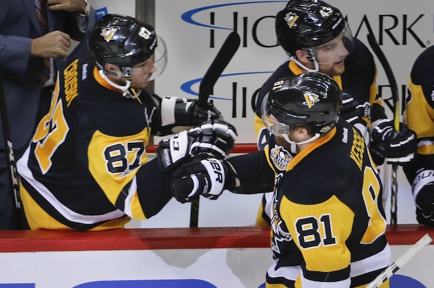 Pittsburgh Penguins' Phil Kessel (81) is greeted by Sidney Crosby (87) from the bench after he scored against the Ottawa Senators during the third period of Game 2 of the Eastern Conference final in the NHL hockey Stanley Cup playoffs, Monday, May 15, 2017, in Pittsburgh. The Penguins won 1-0. (AP Photo/Gene J.Puskar) Pittsburgh Penguins' Phil Kessel (81) is greeted by Sidney Crosby (87) from the bench after he scored against the Ottawa Senators during the third period of Game 2 of the Eastern Conference final in the NHL hockey Stanley Cup playoffs, Monday, May 15, 2017, in Pittsburgh. The Penguins won 1-0. (AP Photo/Gene J.Puskar)