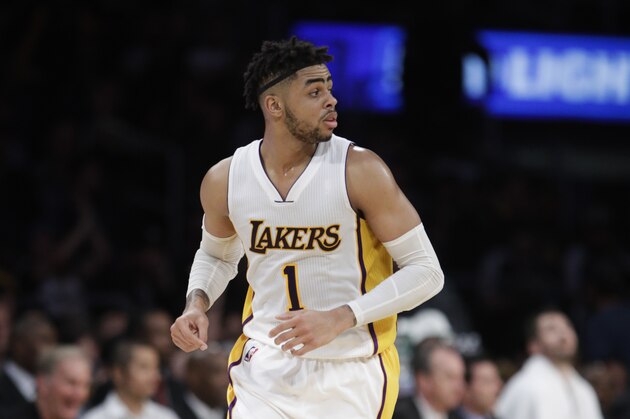 Los Angeles Lakers' D'Angelo Russell makes his way down the court during the second half of an NBA basketball game against the Cleveland Cavaliers Sunday, March 19, 2017, in Los Angeles. (AP Photo/Jae C. Hong)