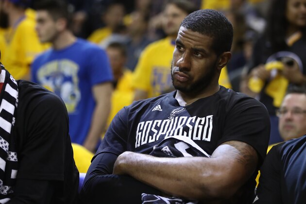 OAKLAND, CA - MAY 16:  LaMarcus Aldridge #12 of the San Antonio Spurs sits on the bench in the final minutes of their 136-100 loss to the Golden State Warriors in Game Two of the NBA Western Conference Finals at ORACLE Arena on May 16, 2017 in Oakland, California. NOTE TO USER: User expressly acknowledges and agrees that, by downloading and or using this photograph, User is consenting to the terms and conditions of the Getty Images License Agreement.  (Photo by Ezra Shaw/Getty Images)