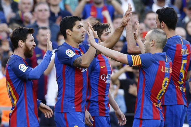 FC Barcelona's Luis Suarez, center, celebrates after scoring during the Spanish La Liga soccer match between FC Barcelona and Villarreal at the Camp Nou stadium in Barcelona, Spain, Saturday, May 6, 2017. (AP Photo/Manu Fernandez)