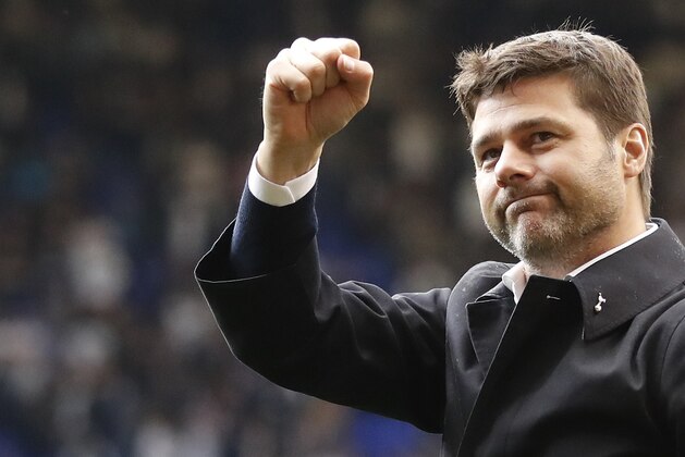 Tottenham's manager Mauricio Pochettino waves to fans as he walks around the pitch during a final ceremony on the pitch after the last match played at the ground, the English Premier League soccer match between Tottenham Hotspur and Manchester United at White Hart Lane stadium in London, Sunday, May 14, 2017. It was the last Spurs match at the old stadium, a new stadium is being built on the site. (AP Photo/Frank Augstein)