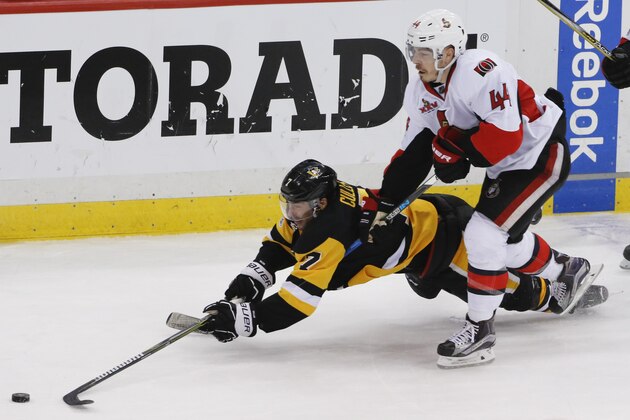 Pittsburgh Penguins' Matt Cullen (7) dives for the puck as Ottawa Senators' Jean-Gabriel Pageau (44) defends during the third period of Game 2 of the Eastern Conference final in the NHL hockey Stanley Cup playoffs, Monday, May 15, 2017, in Pittsburgh. The Penguins won 1-0. (AP Photo/Gene J.Puskar)
