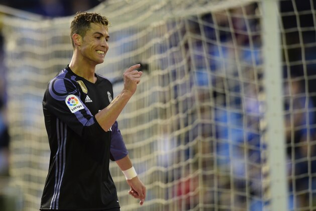 Real Madrid's Portuguese forward Cristiano Ronaldo gestures after missing a goal opportunity during the Spanish league football match RC Celta de Vigo vs Real Madrid CF at the Balaidos stadium in Vigo on May 17, 2017. / AFP PHOTO / MIGUEL RIOPA        (Photo credit should read MIGUEL RIOPA/AFP/Getty Images)