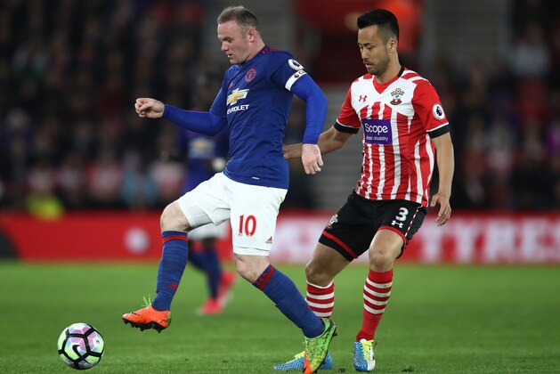 SOUTHAMPTON, ENGLAND - MAY 17: Wayne Rooney of Manchester United is put under pressure from Maya Yoshida of Southampton during the Premier League match between Southampton and Manchester United at St Mary's Stadium on May 17, 2017 in Southampton, England.  (Photo by Julian Finney/Getty Images)