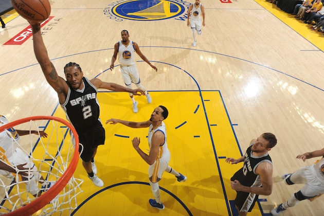OAKLAND, CA - MAY 14: Kawhi Leonard #2 of the San Antonio Spurs dunks against the Golden State Warriors in Game One of the Western Conference Finals of the 2017 NBA Playoffs on May 14, 2017 at ORACLE Arena in Oakland, California. NOTE TO USER: User expressly acknowledges and agrees that, by downloading and/or using this Photograph, user is consenting to the terms and conditions of the Getty Images License Agreement. Mandatory Copyright Notice: Copyright 2017 NBAE (Photo by Andrew D. Bernstein/NBAE via Getty Images)