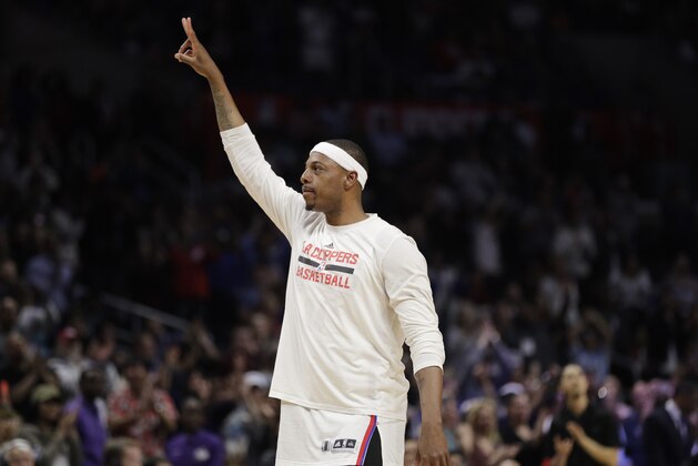 Los Angeles Clippers' Paul Pierce acknowledges the fans after the team showed a tribute video for him during an NBA basketball game against the Sacramento Kings on Wednesday, April 12, 2017, in Los Angeles. The Clippers won 115-95. (AP Photo/Jae C. Hong)