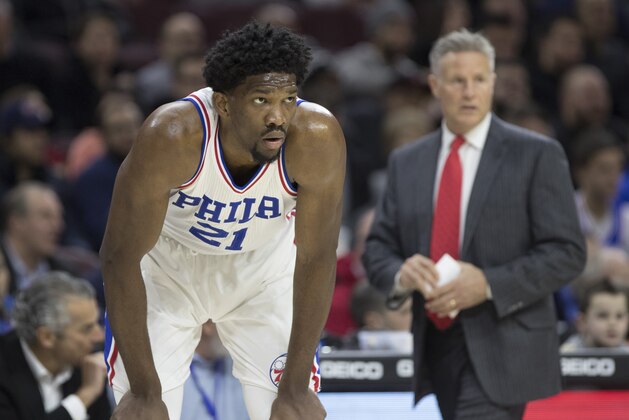 PHILADELPHIA, PA - DECEMBER 20: Joel Embiid #21 and head coach Brett Brown of the Philadelphia 76ers looks on against the New Orleans Pelicans in the first quarter at Wells Fargo Center on December 20, 2016 in Philadelphia, Pennsylvania. The Pelicans defeated the 76ers 108-93. NOTE TO USER: User expressly acknowledges and agrees that, by downloading and or using this photograph, User is consenting to the terms and conditions of the Getty Images License Agreement. (Photo by Mitchell Leff/Getty Images)