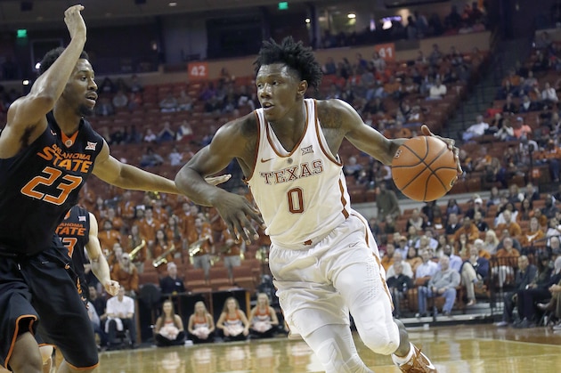 AUSTIN, TX - JANUARY 4: Tevin Mack #0 of the Texas Longhorns drives around Leyton Hammonds #23 of the Oklahoma State Cowboys at the Frank Erwin Center on January 4, 2017 in Austin, Texas. (Photo by Chris Covatta/Getty Images)