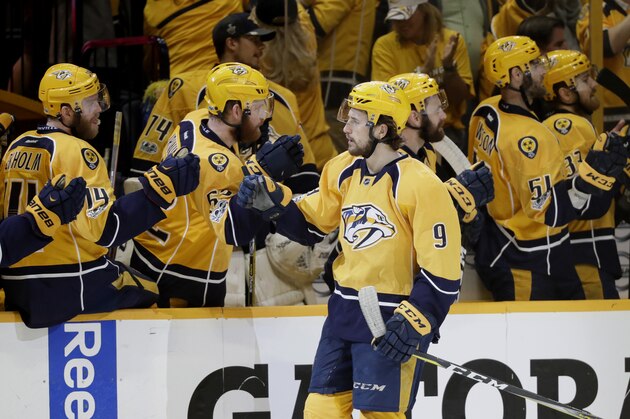 Nashville Predators left wing Filip Forsberg (9), of Sweden, is greeted by teammates after scoring a goal during the third period in Game 3 of the Western Conference final against the Anaheim Ducks in the NHL hockey Stanley Cup playoffs Tuesday, May 16, 2017, in Nashville, Tenn. The Predators won 2-1. (AP Photo/Mark Humphrey)
