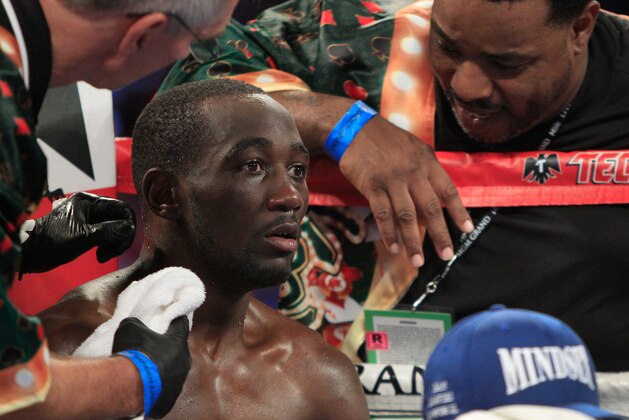 LAS VEGAS, NV - JULY 23:  WBO junior welterweight champion Terence Crawford is treated in his corner between rounds during his unification fight with WBC champion Viktor Postol of Ukraine at MGM Grand Garden Arena on July 23, 2016 in Las Vegas, Nevada. Crawford won the fight by unanimous decision.  (Photo by Steve Marcus/Getty Images)