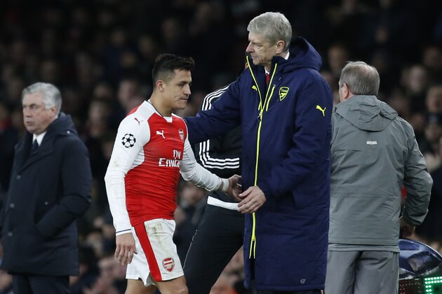 Arsenal's French manager Arsene Wenger (R) greets Arsenal's Chilean striker Alexis Sanchez after he is substituted during the UEFA Champions League last 16 second leg football match between Arsenal and Bayern Munich at The Emirates Stadium in London on March 7, 2017. / AFP PHOTO / IKIMAGES / Ian KINGTON        (Photo credit should read IAN KINGTON/AFP/Getty Images)