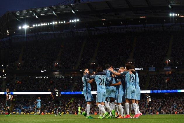 Manchester City players celebrate their third goal scored by Manchester City's Ivorian midfielder Yaya Toure during the English Premier League football match between Manchester City and West Bromwich Albion at the Etihad Stadium in Manchester, north west England, on May 16, 2017. / AFP PHOTO / Anthony Devlin / RESTRICTED TO EDITORIAL USE. No use with unauthorized audio, video, data, fixture lists, club/league logos or 'live' services. Online in-match use limited to 75 images, no video emulation. No use in betting, games or single club/league/player publications.  /         (Photo credit should read ANTHONY DEVLIN/AFP/Getty Images)