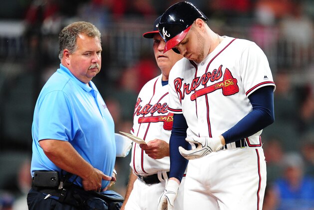 ATLANTA, GA - MAY 17: Freddie Freeman #5 of the Atlanta Braves is removed by Manager Brian Snitker #43 as trainer Jim Lovell watches after being hit by a fifth inning pitch against the Toronto Blue Jays at SunTrust Park on May 17, 2017 in Atlanta, Georgia. (Photo by Scott Cunningham/Getty Images)