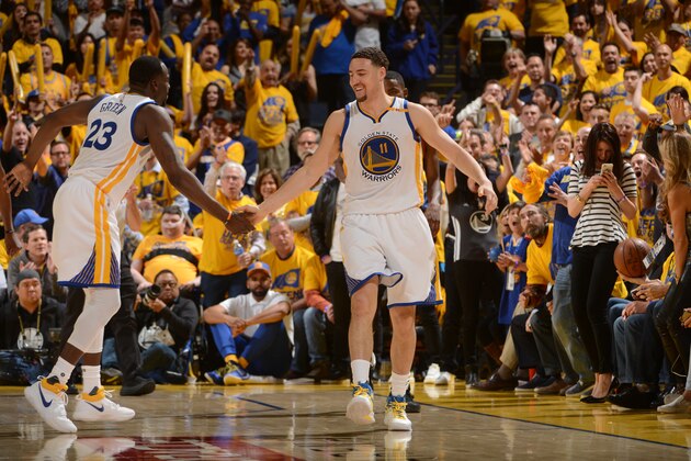 OAKLAND, CA - APRIL 16:  Draymond Green #23 and Klay Thompson #11 of the Golden State Warriors high five during the Western Conference Quarterfinals game against the Portland Trail Blazers during the 2017 NBA Playoffs on April 16, 2017 at ORACLE Arena in Oakland, California. NOTE TO USER: User expressly acknowledges and agrees that, by downloading and or using this photograph, user is consenting to the terms and conditions of Getty Images License Agreement. Mandatory Copyright Notice: Copyright 2017 NBAE (Photo by Noah Graham/NBAE via Getty Images)