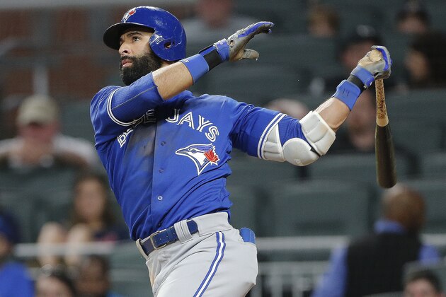 Toronto Blue Jays' Jose Bautista (19) follows through on a solo home run during the eighth inning against the Atlanta Braves in a baseball game Wednesday, May 17, 2017, in Atlanta. Atlanta won 8-4. (AP Photo/John Bazemore)